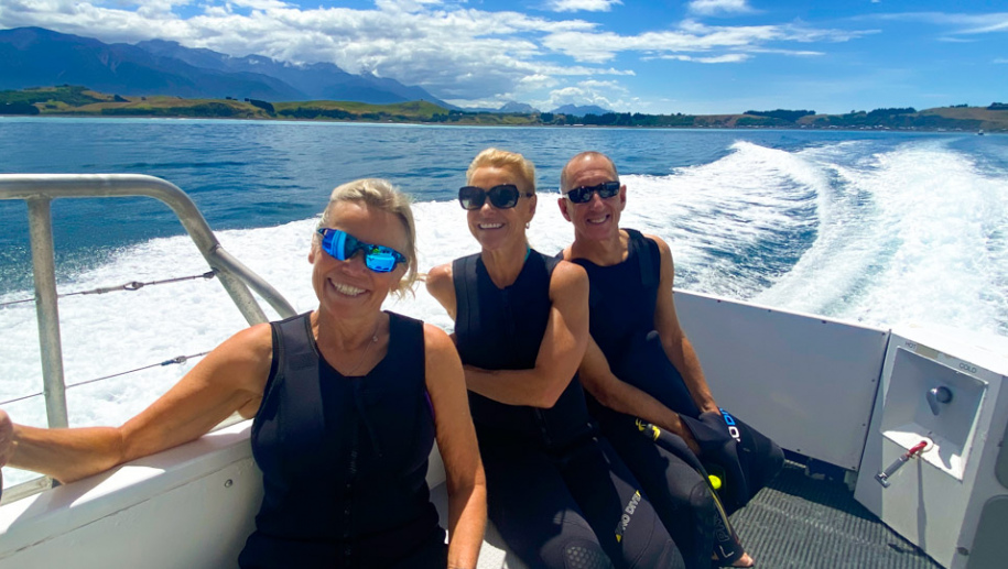4. Three happy guests Dolphin swim boat ride